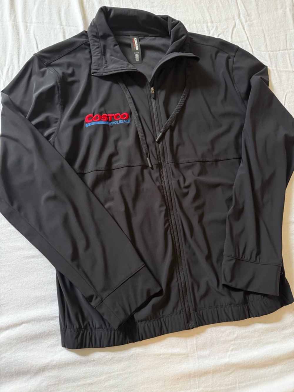Kirkland Signature Black Lightweight Zip Jacket with Red & Blue Logo